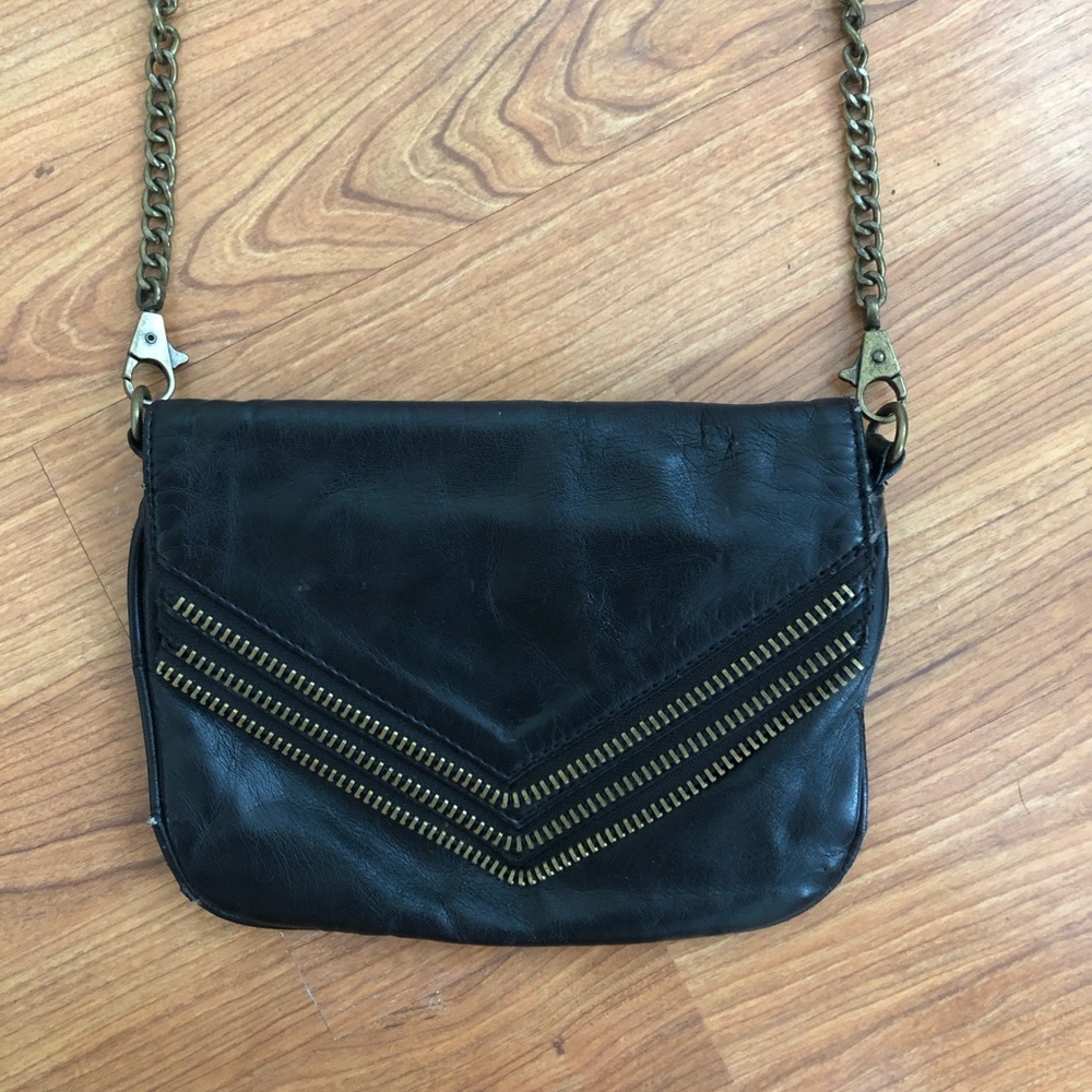 Black Matt + Nat purse with zipper detailing.
